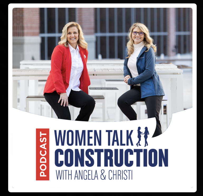 Picture of Angela and Christi from Women talk construcition podcast sitting with a building in the background.